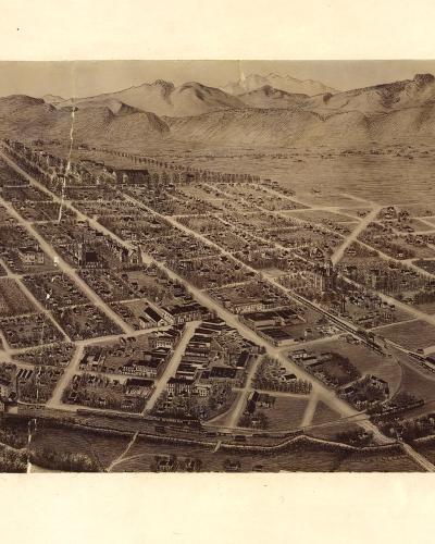 A sepia-toned historical bird's-eye view map or lithograph depicting a grid-planned town with scattered buildings, open fields, and mountains in the background, featuring Library of Congress stamping and handwritten numbers.