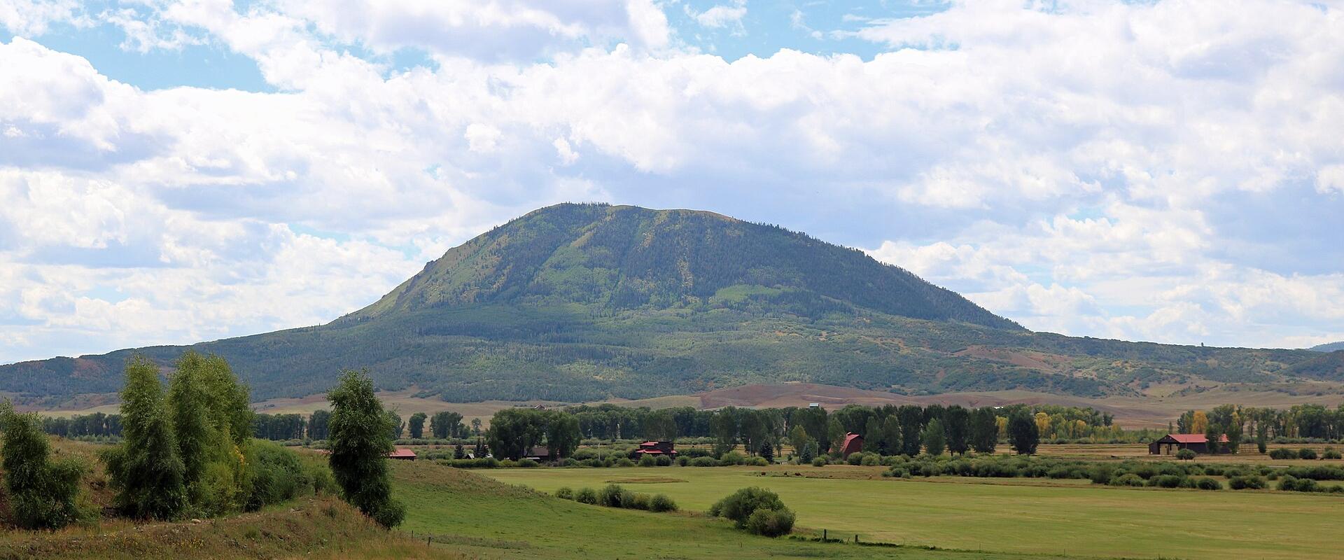 Elk Mountain rising over ranchland in Routt County