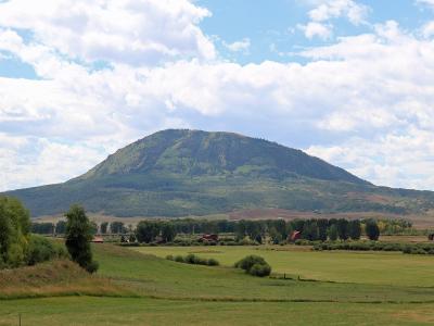 Elk Mountain rising over ranchland in Routt County