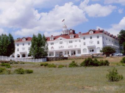 The white Georgian Revival facade of The Stanley Hotel above Estes Park