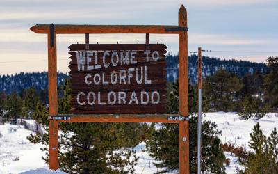 The Welcome to Colorful Colorado sign at the state line on US 287
