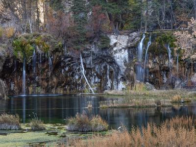 Waterfalls spilling into the turquoise travertine pool of Hanging Lake