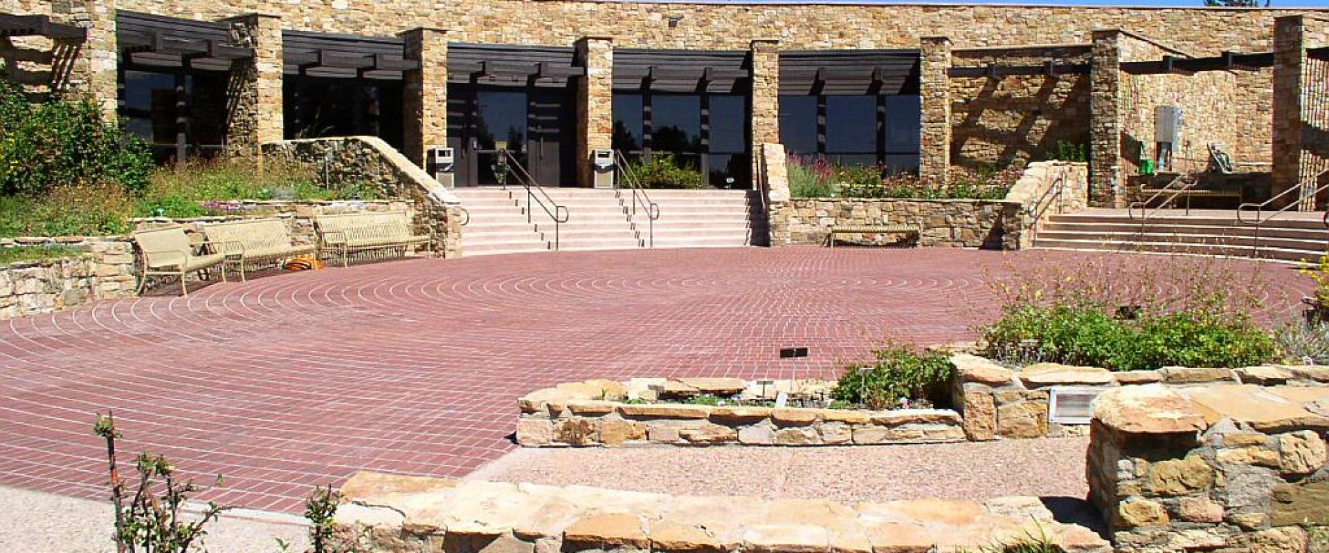 Stone-walled exterior and plaza of the Anasazi Heritage Center near Dolores, Colorado
