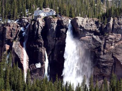 Bridal Veil Falls plunging from the cliff below its historic power plant, Telluride