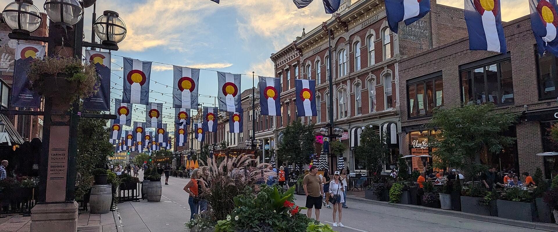 Planters and flag bunting along Larimer Square in Denver